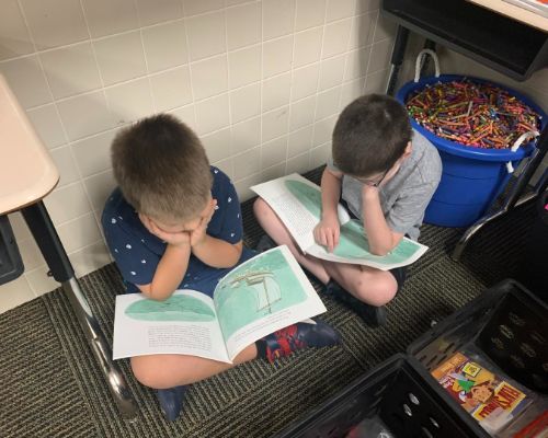  Two boys from Mrs. Williams's 3rd grade class partner reading 