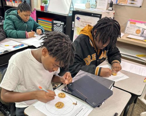 Students using toothpicks as they excavated artifacts and mapping their discoveries.