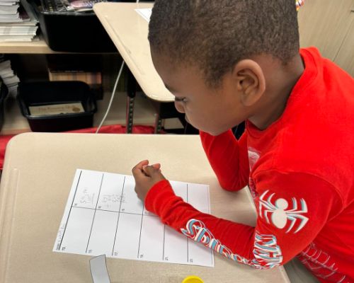  Student working on math worksheet