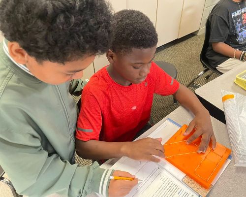  Two students learning about area of parallels so they broke out the geoboards and rubber bands