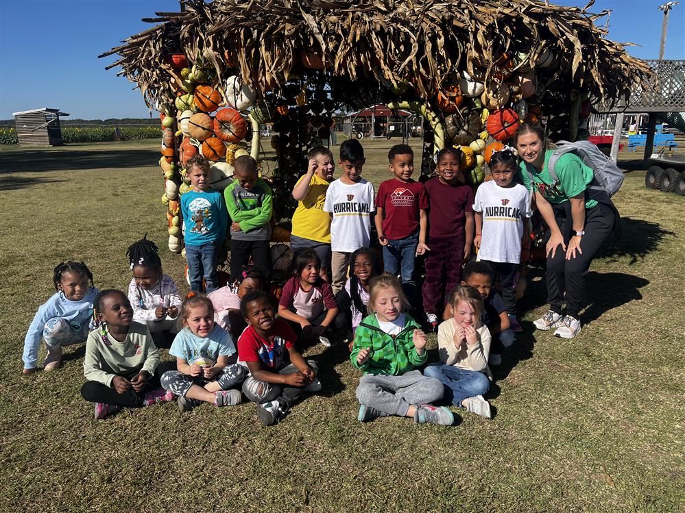  Teacher with students at the pumpkin patch