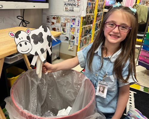  girl milking fake cow