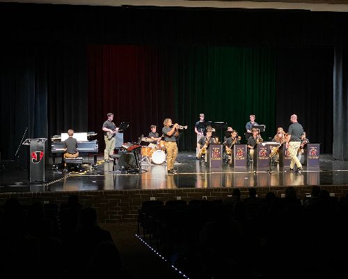  Centarrius plays trumpet solo with rest of Jazz Ensemble I playing on PAC stage.