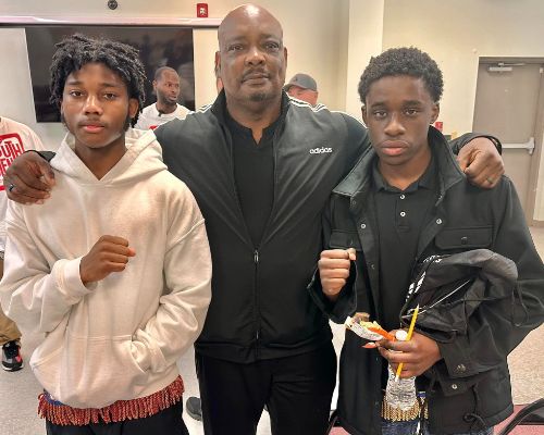  Two students stand with security officer, Mr. Willis
